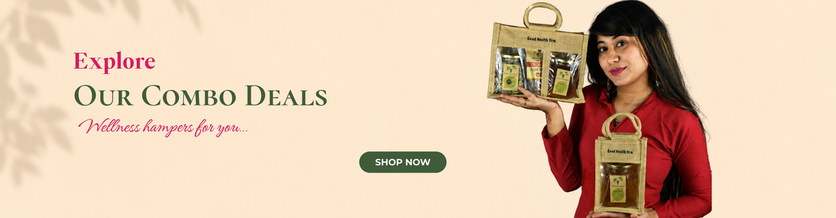 A promotional website banner on a light beige background with subtle leaf shadows. On the left, the text reads 'Explore Our Combo Deals: Wellness hampers for you...' above a dark green 'Shop Now' button. On the right, a woman wearing a red top is holding up two burlap gift bags with clear windows displaying packaged wellness products.