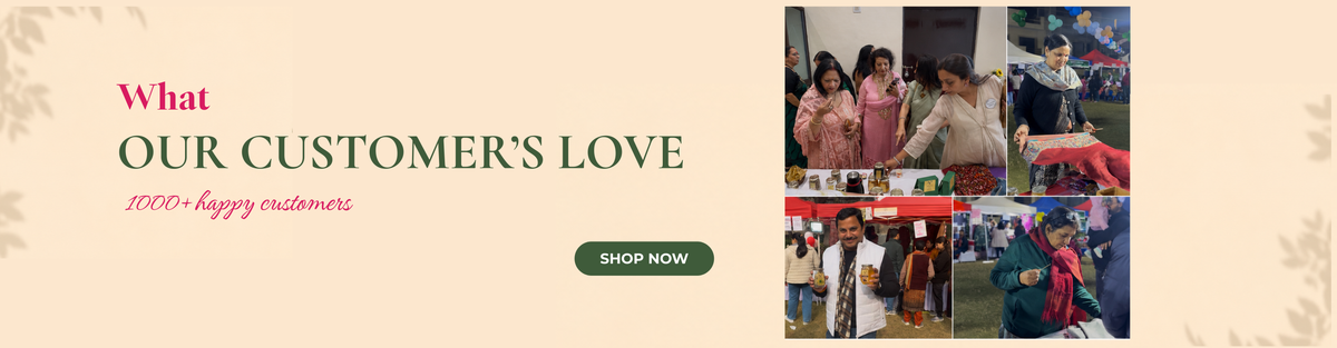 A promotional website banner on a light beige background with subtle leaf shadows. On the left, the text reads 'What OUR CUSTOMER'S LOVE' followed by '1000+ happy customers' in cursive, positioned above a dark green 'Shop Now' button. On the right is a collage of four photos showing various customers happily interacting with products, fabrics, and jars at market stalls.